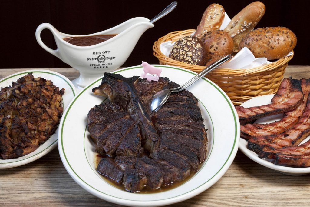 Menu page showing Peter Luger steakhouse prices and dish options including steaks and sides