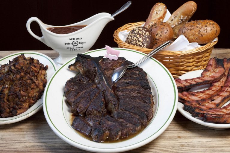 Menu page showing Peter Luger steakhouse prices and dish options including steaks and sides