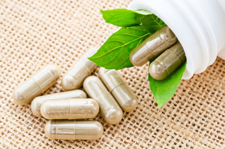 Transparent, glossy vegetable pullulan capsules on a white background